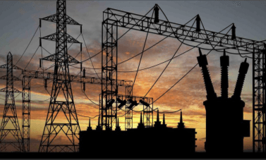 Electrical substation silhouetted at sunset, used as the cover image for the billing system