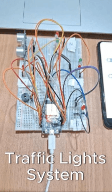 Arduino traffic light prototype on a breadboard with LEDs and an ultrasonic sensor